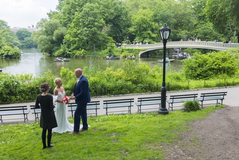 Wedding officiant by the Bow Bridge in Central Park